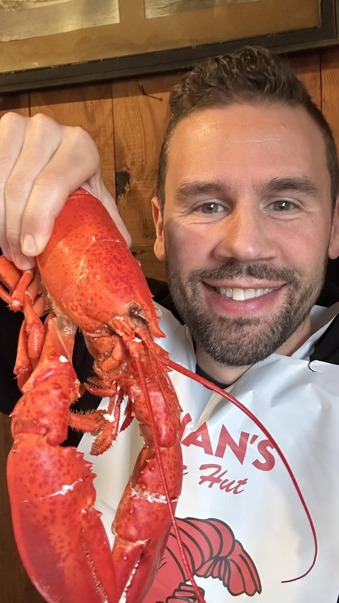 Jason Nappi holding a cooked Maine lobster at Nunan’s Lobster Hut